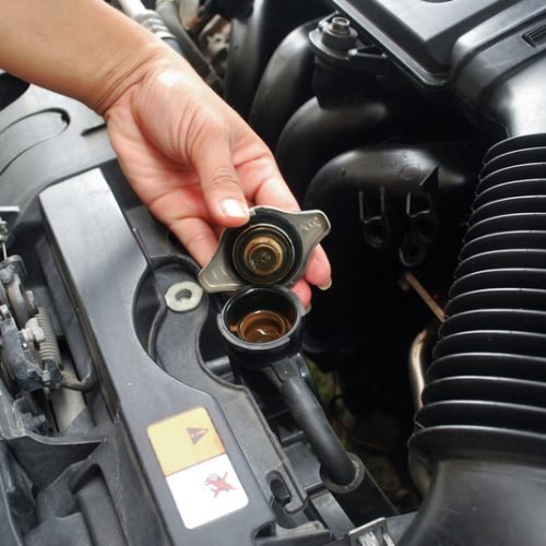 Car radiator cooling system. Car radiator system Maintenance of opening the radiator cap Car cooling system.